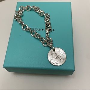 Retired Authentic Tiffany & Co. Notes Round Tag Bracelet